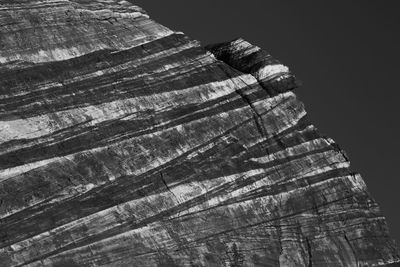 Low angle view of rock formation against sky