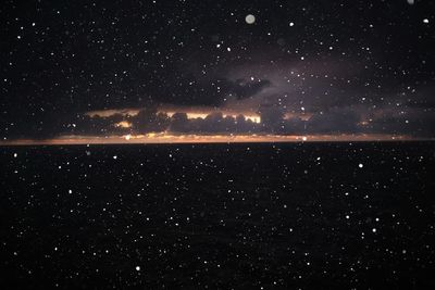 Scenic view of sea against sky at night