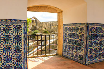 Historic building seen through doorway of castle