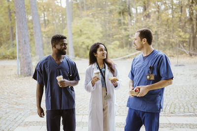 Smiling multiracial healthcare workers talking during break