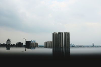 Modern buildings in city against sky