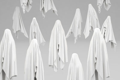 Close-up of clothes hanging against white background