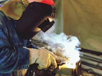 Close-up of man welding in workshop