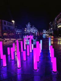 Illuminated buildings in city at night