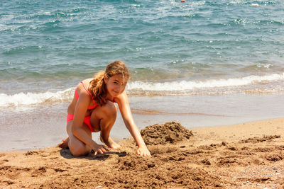 Full length of girl on beach