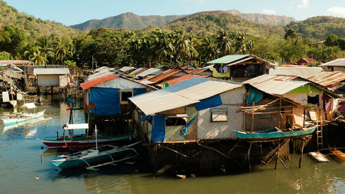 Coron city with slums and poor district. old wooden house standing on the sea in the fishing village