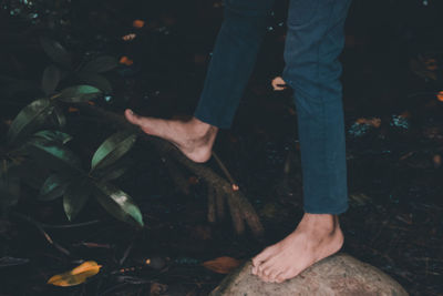 Low section of people standing on land