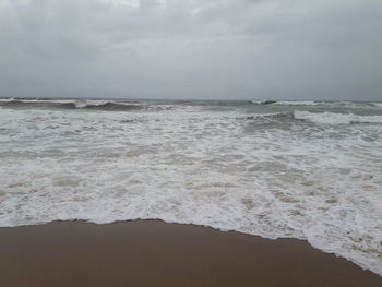 Scenic view of beach and sea against sky