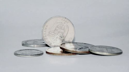 Close-up of coin against white background