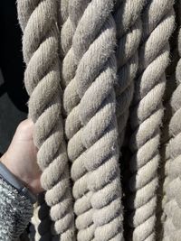 Close-up of hand holding rope