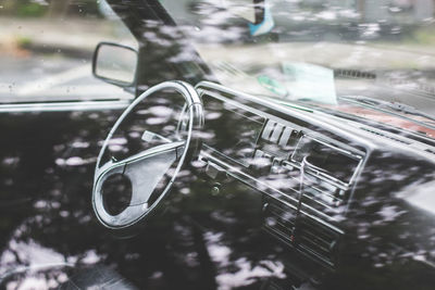 Close-up of raindrops on car windshield