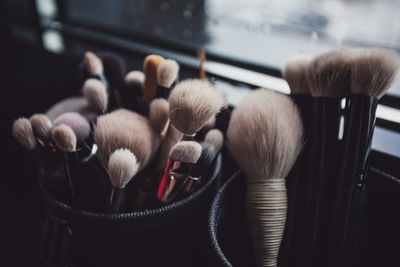 Make-up brushes in containers
