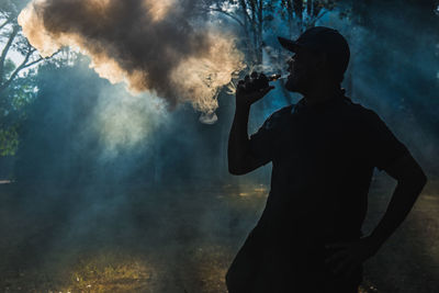 Man smoking electronic cigarette outdoors