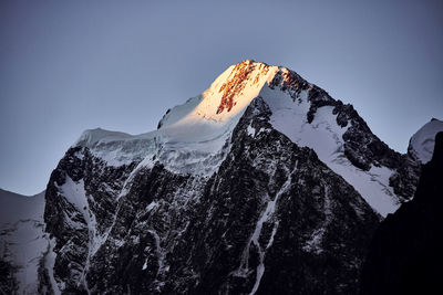 Scenic view of snowcapped mountain against sky