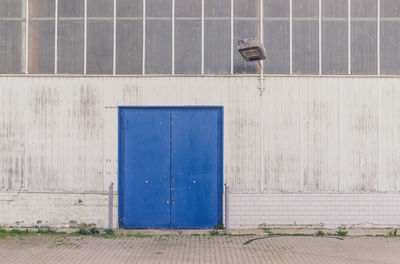 Closed blue door of building