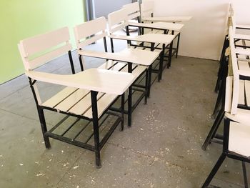 Empty chairs and table in classroom