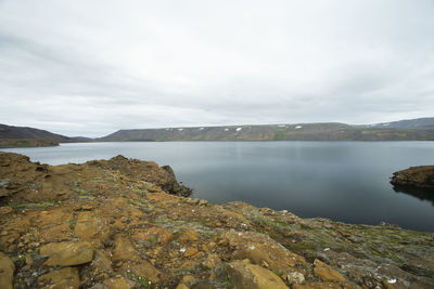 Image shows a shore of a lake in island