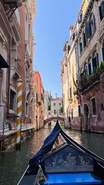 Venice, italy, venetian canals.  gondola with tourists float along the canals of venice.