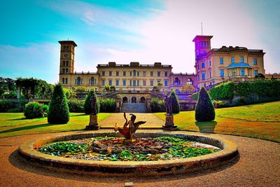 Scenic view of fountain in front of building