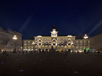 View of illuminated building against sky at night