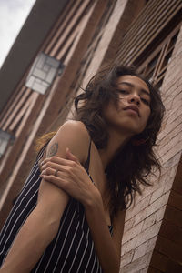 Low angle view of woman standing at home