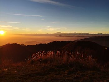 Scenic view of landscape against sky during sunset