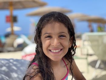 Portrait of smiling young girl on the beach