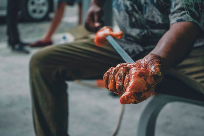 Close-up of man preparing food