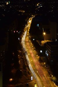High angle view of light trails on road at night