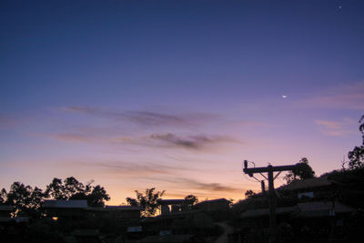 Silhouette of buildings against sky during sunset