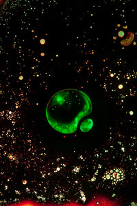 Close-up of bubbles against black background