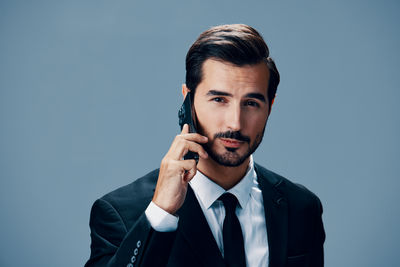 Portrait of young man against white background