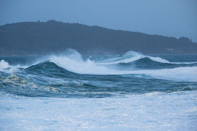 Tall ocean waves in a rough sea on a stormy day