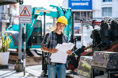 Low angle view of man working on paper