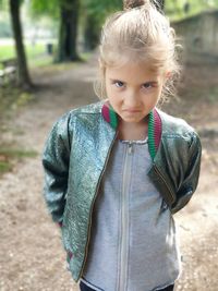 Portrait of cute girl standing outdoors