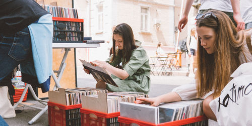 Young woman using smart phone in city