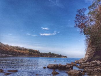 Scenic view of sea against blue sky