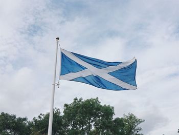 Low angle view of flag against sky