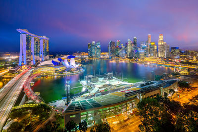 High angle view of illuminated city buildings at night