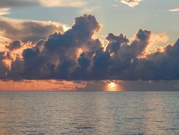 Scenic view of sea against sky at sunset