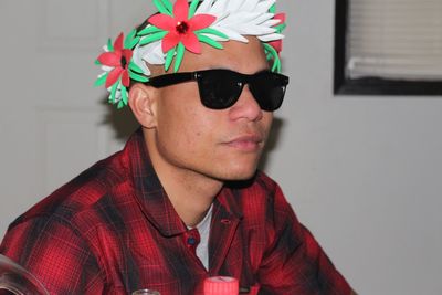 Man wearing tiara on head at home