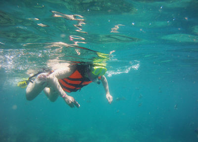 Woman swimming in sea