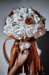 Close-up of woman holding rose bouquet
