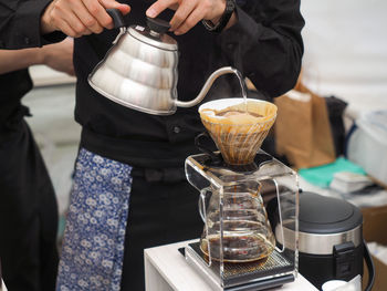 Close-up of pouring tea in glass