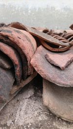 Close-up of rusty stack on rock