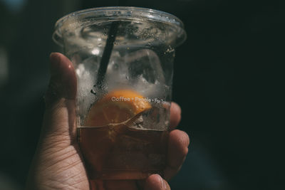 Close-up of hand holding glass of wine