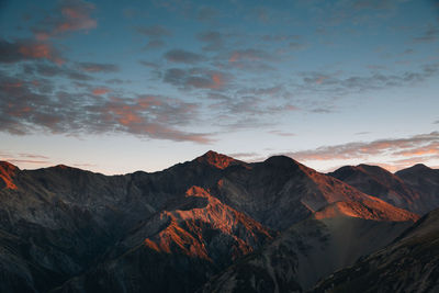 Scenic view of mountains against sky during sunset