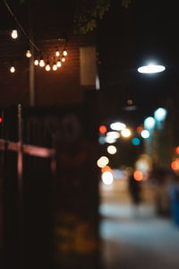 Defocused image of illuminated street lights at night