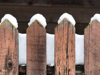Close-up of wooden posts on fence