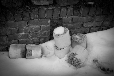 Snow covered stone on field